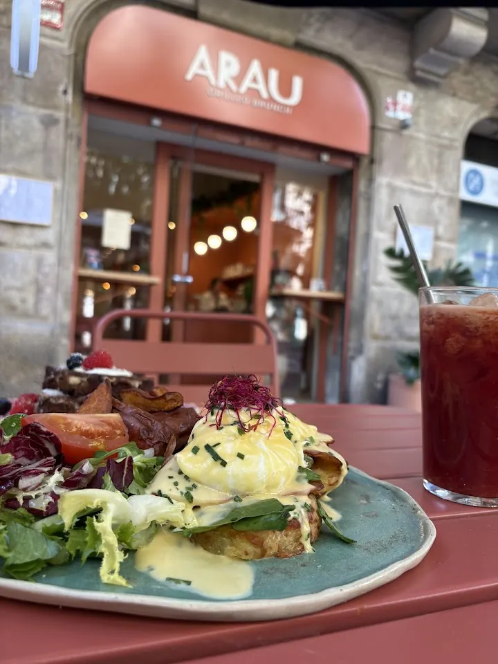 ARAU's terrace with brunch and the facade behind